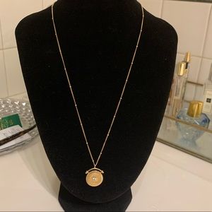 Anthropologie gold coin necklace with center Crystal accent